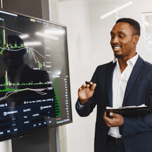A man in business attire using technology for a presentation, to show the positive use of AI at work